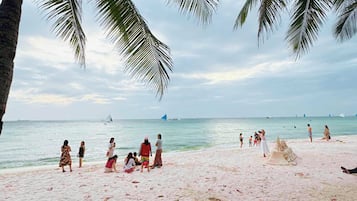 On the beach, white sand, beach towels