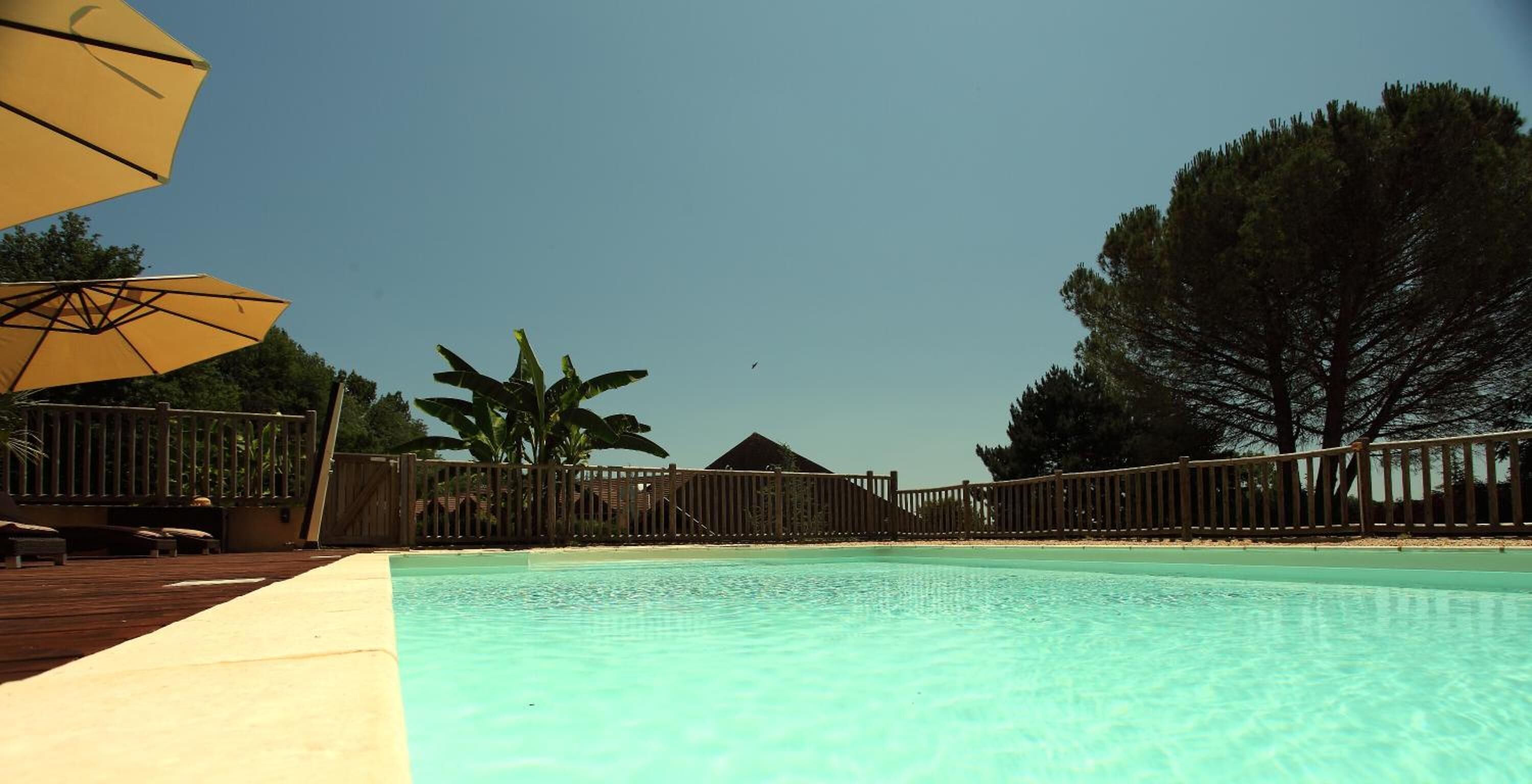 seasonal outdoor pool, open 10 am to 10 pm, pool umbrellas