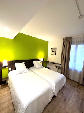 Twin Room | Premium bedding, desk, laptop workspace, blackout curtains