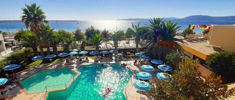 Outdoor pool, open 9:00 AM to 7:00 PM, pool umbrellas, pool loungers