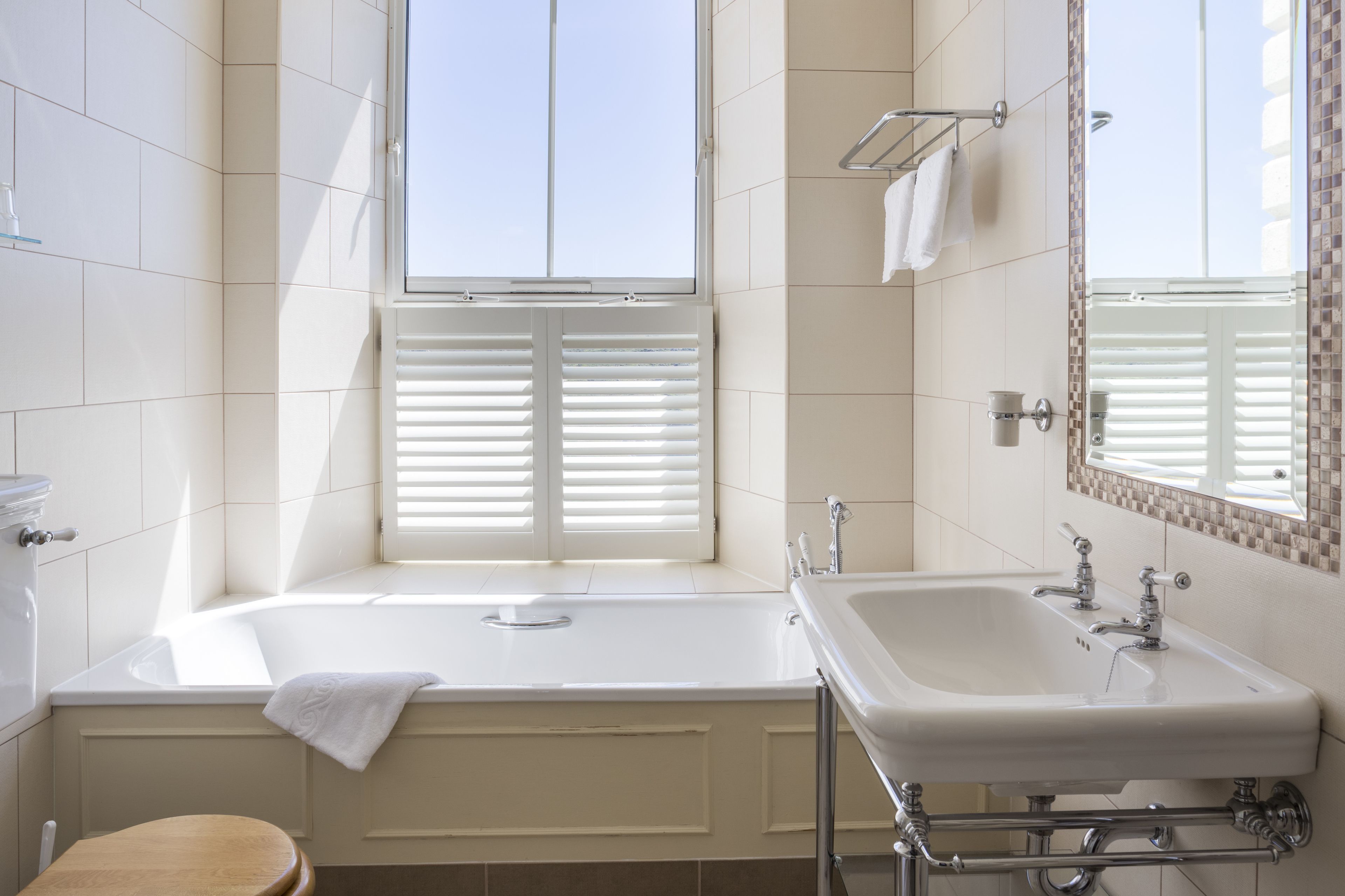 designer toiletries, hair dryer, bathrobes, towels