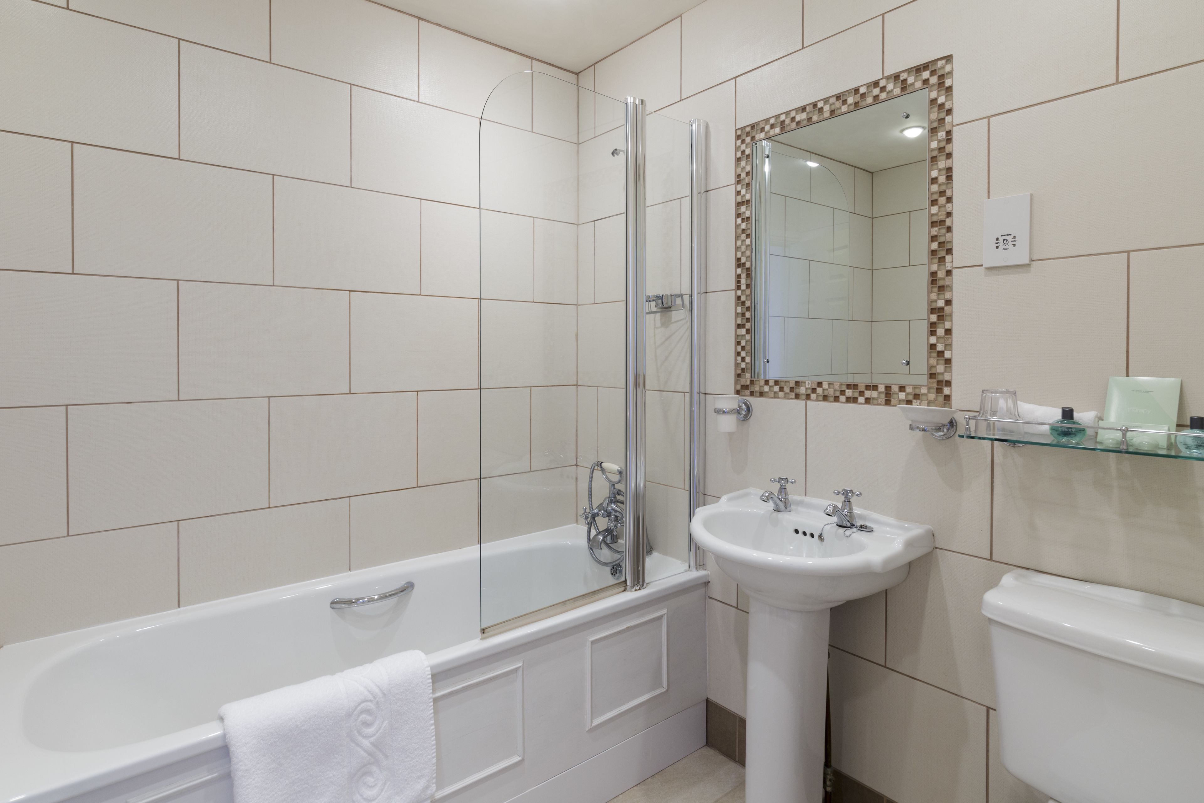 designer toiletries, hair dryer, bathrobes, towels