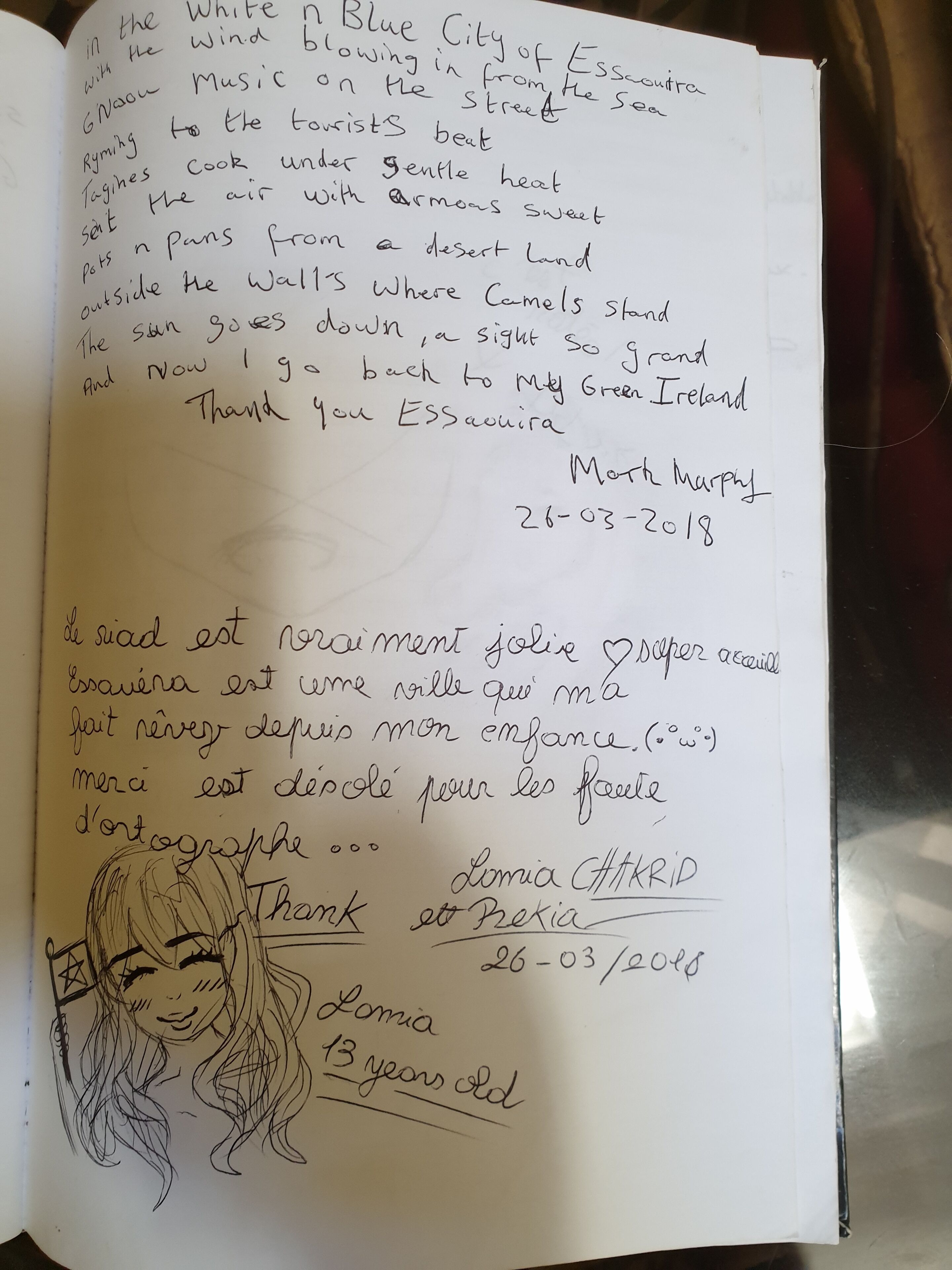 A handwritten page with a poem and a drawing of a girl.