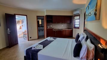 Suite, Pool View | Minibar, desk, iron/ironing board, free WiFi