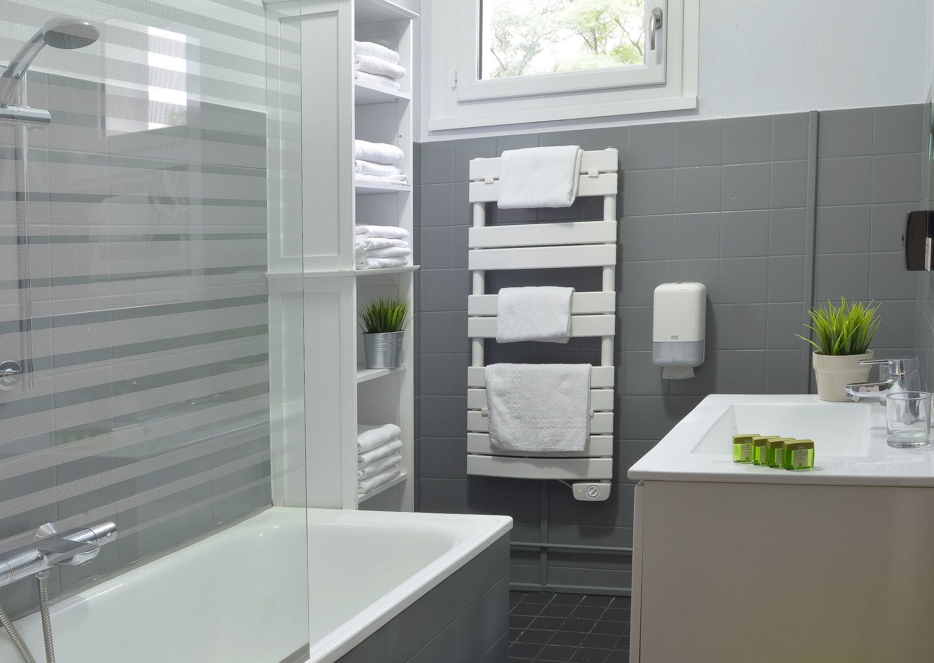 superior family room | bathroom | hair dryer, towels, soap, shampoo