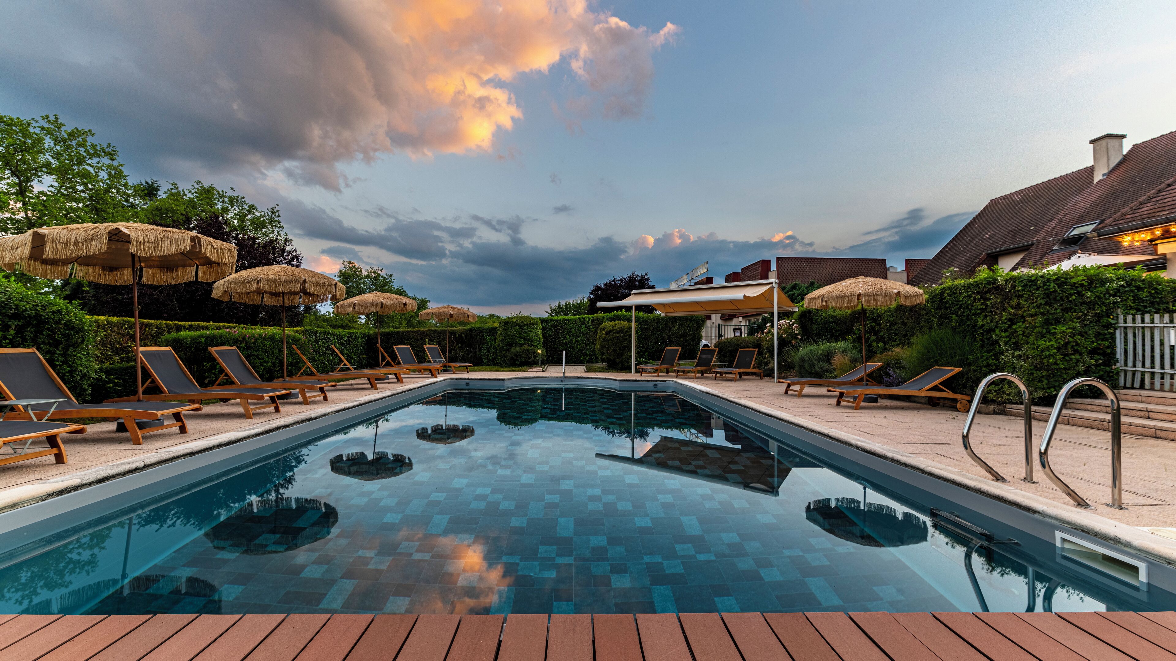 seasonal outdoor pool, pool umbrellas, pool loungers