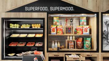 A food display with various snacks and cereals, including Kellogg's and Maxx.