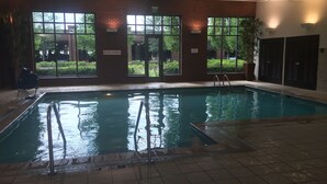 An indoor pool with clear glass walls, a "No Diving" sign, and a "No Diving" floor sign. - Hyatt Place Columbus/OSU (Columbus)