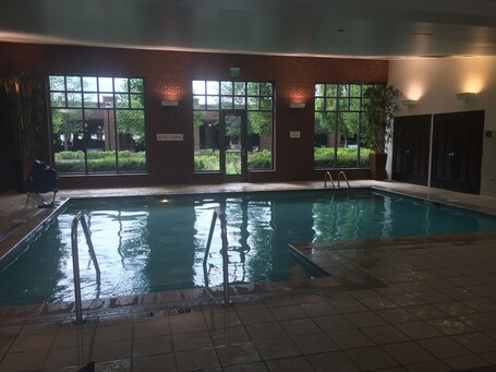 Indoor pool, open 6:00 AM to 10:00 PM, pool loungers