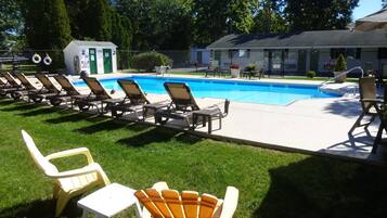 Seasonal outdoor pool, open 9:00 AM to 8:00 PM, pool umbrellas