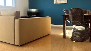 Apartment | Living area | 82-cm flat-screen TV with digital channels