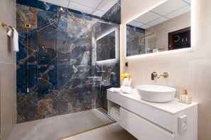 Eco-friendly toiletries, hair dryer, slippers, towels