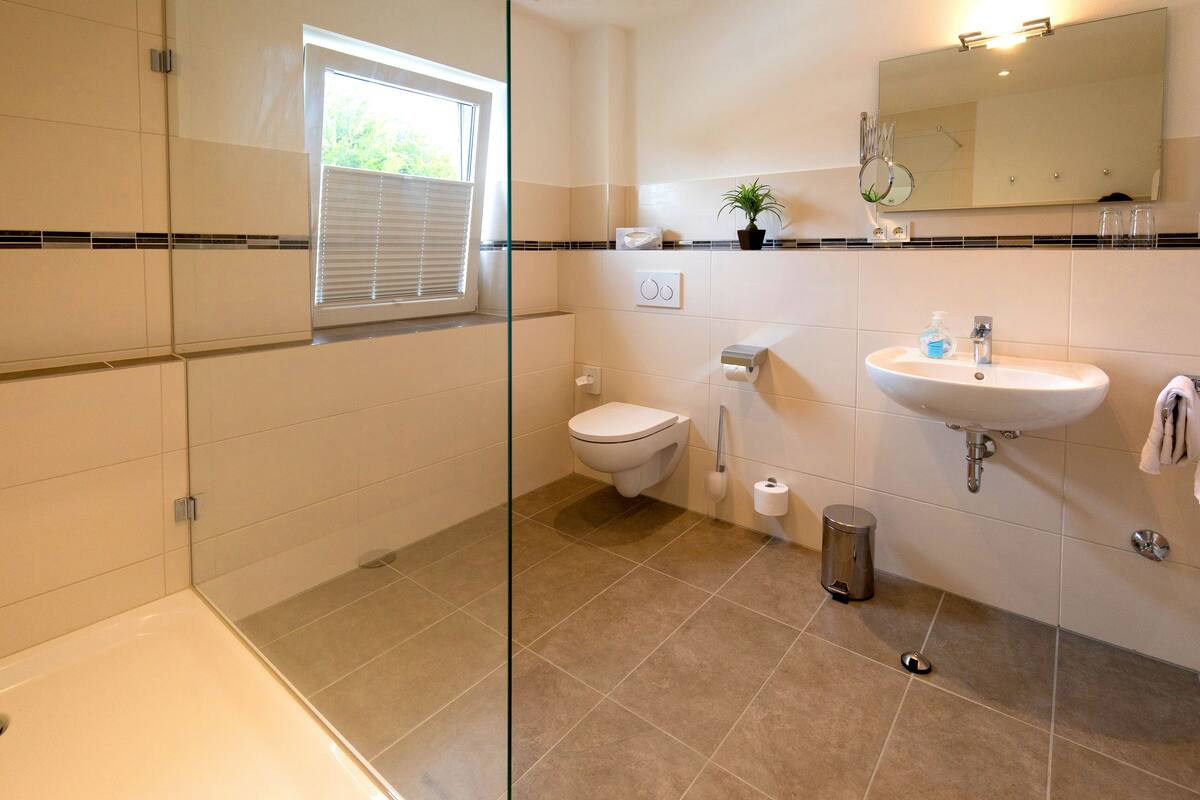 junior suite | bathroom | shower, hair dryer, bathrobes, towels