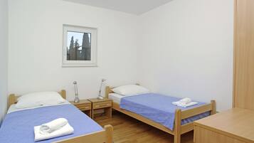 Apartment, 2 Bedrooms, Balcony, Sea View | 1 bedroom, down comforters, desk, iron/ironing board