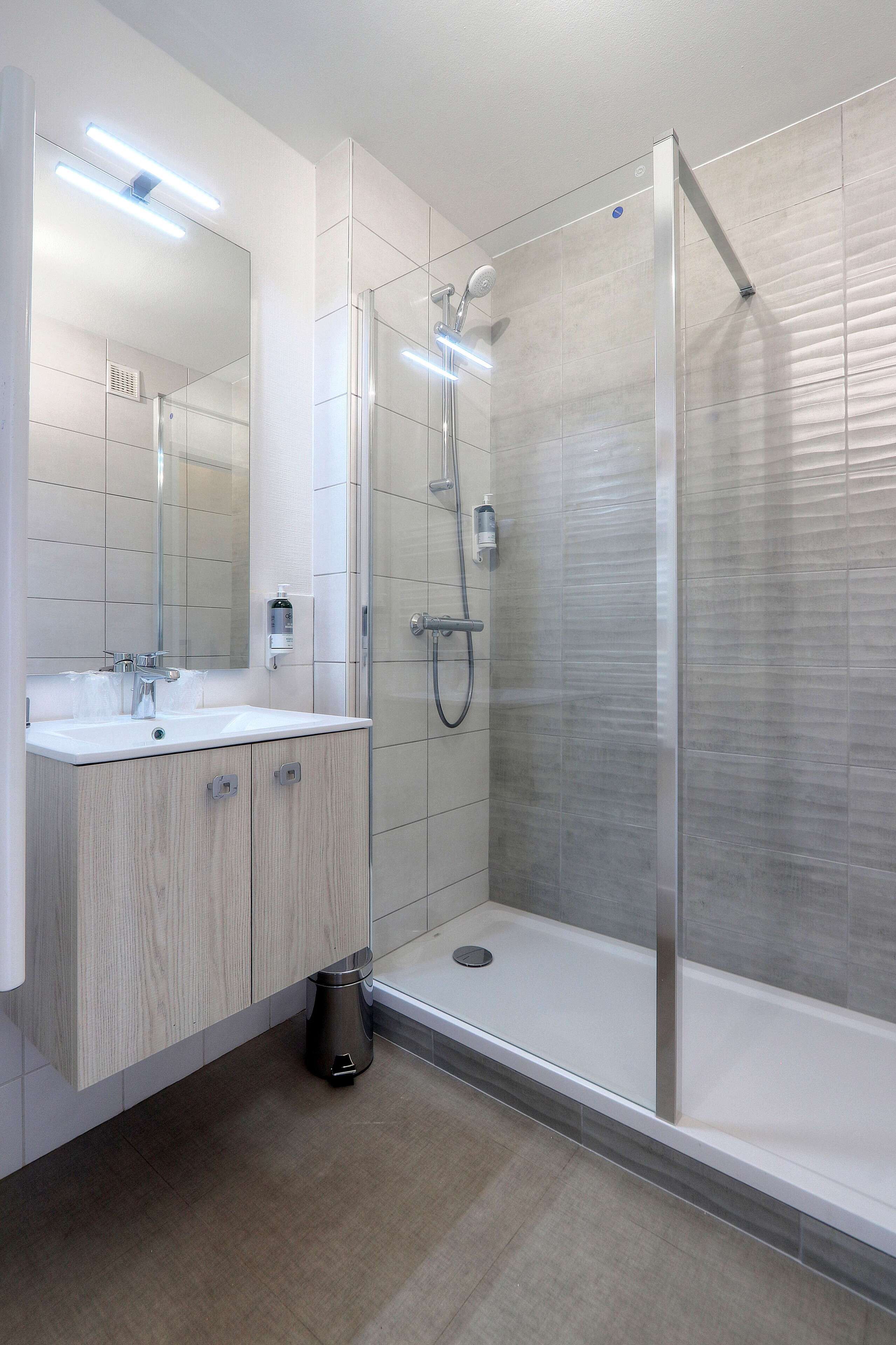 comfort room | bathroom | shower, hair dryer, towels