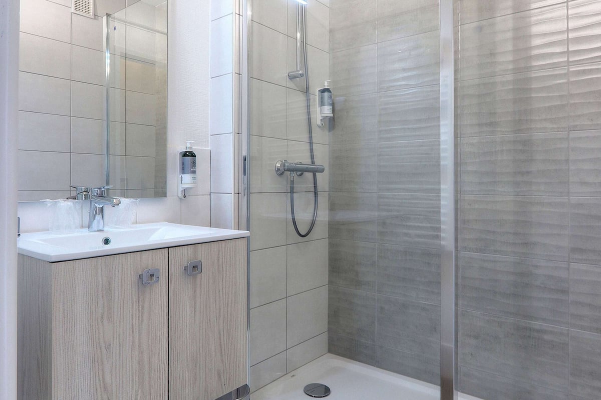 comfort room | bathroom | shower, hair dryer, towels