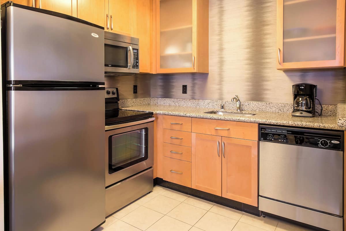 full-sized fridge, microwave, stovetop, dishwasher