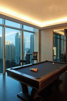 A modern lobby with a reception desk, contemporary chairs, and a polished floor. at Hotel Beaux Arts, Autograph Collection