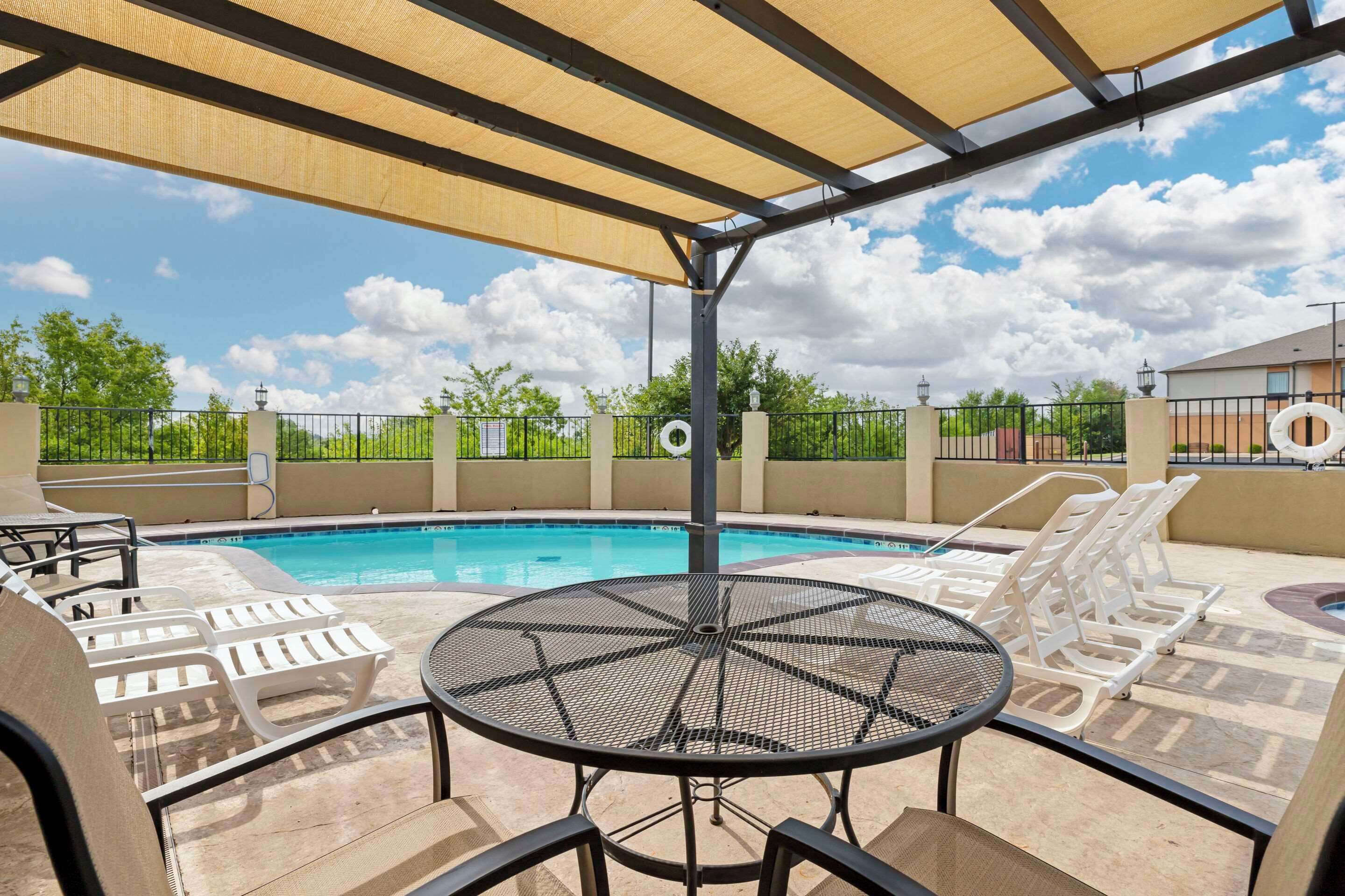 seasonal outdoor pool, open 10:00 am to 10:00 pm, pool umbrellas