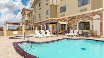 Seasonal outdoor pool, open 10:00 AM to 10:00 PM, pool umbrellas