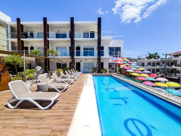 Outdoor pool, open 9:00 AM to 11:00 PM, pool umbrellas, pool loungers