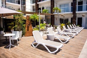 Outdoor pool, open 9:00 AM to 11:00 PM, pool umbrellas, pool loungers