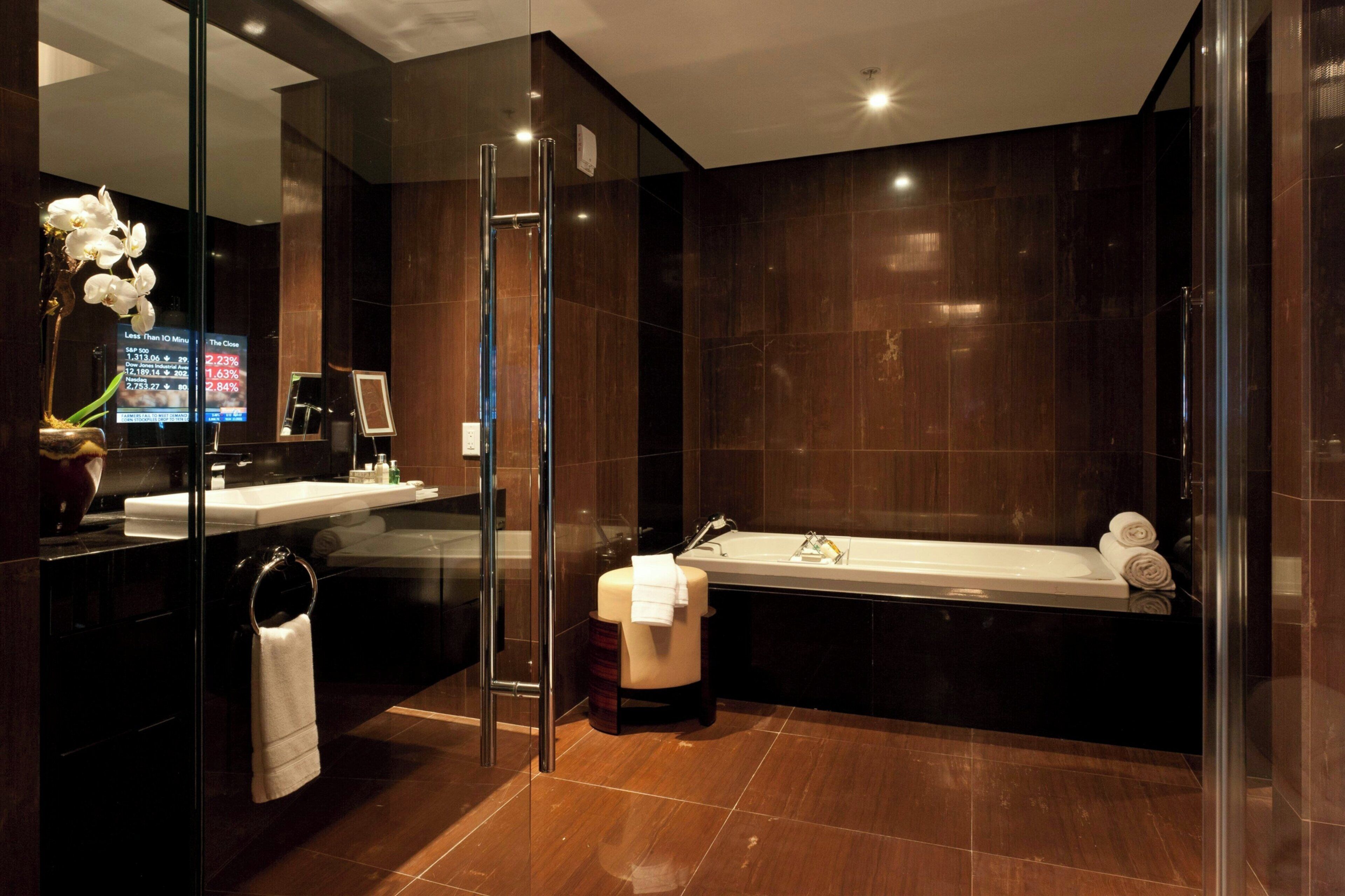 separate bathtub and shower, designer toiletries, hair dryer, bathrobes