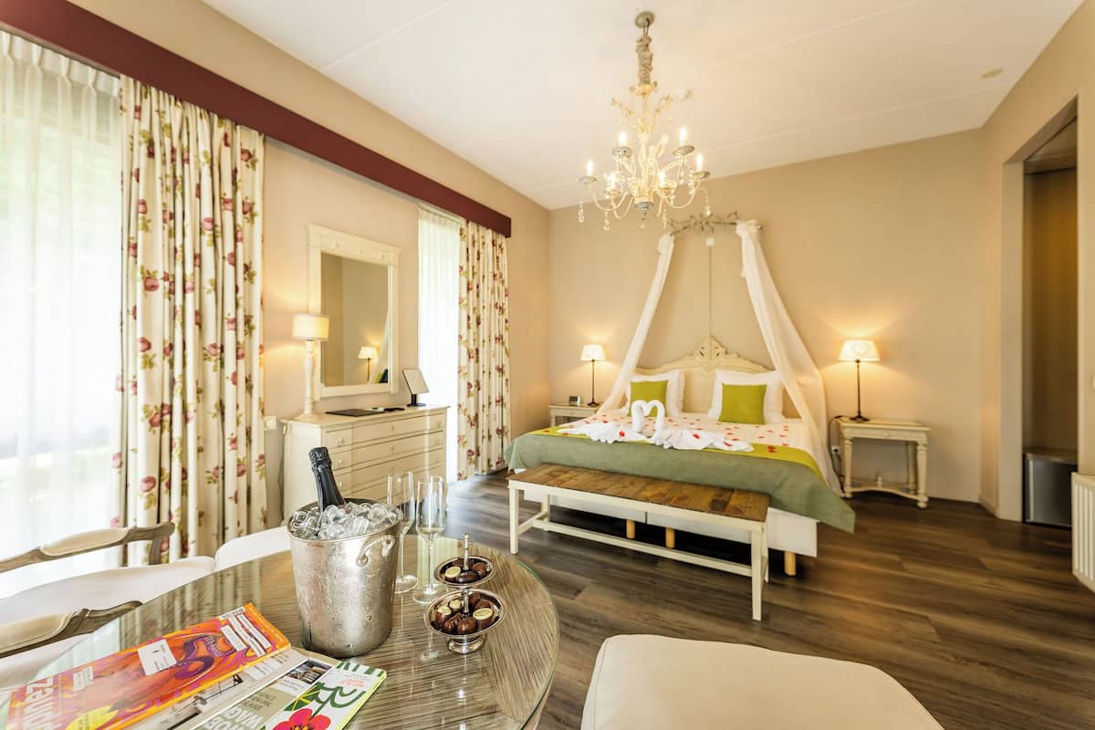 honeymoon suite | desk, blackout curtains, iron/ironing board, bed sheets