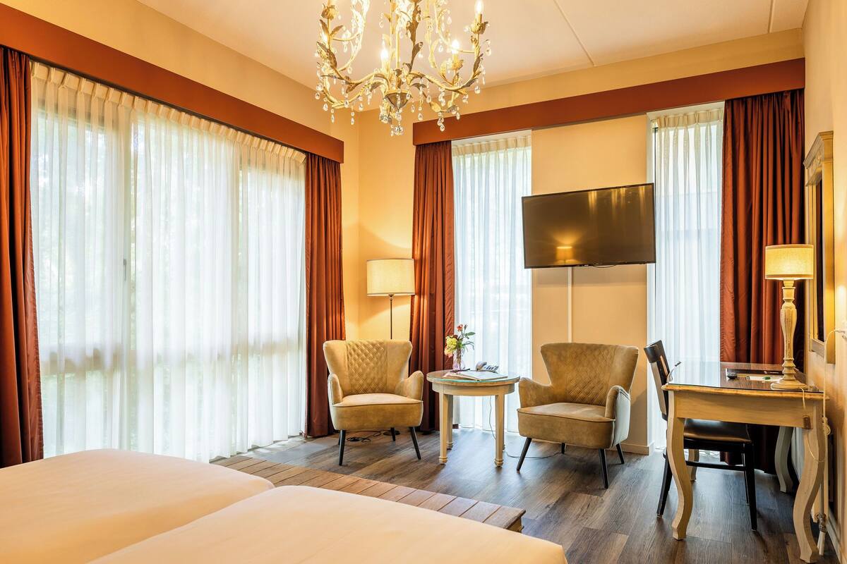 royal suite | desk, blackout curtains, iron/ironing board, bed sheets