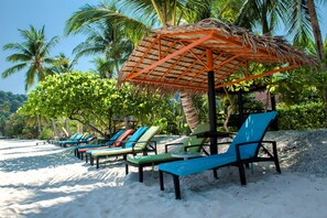 On the beach, white sand, beach towels, scuba diving