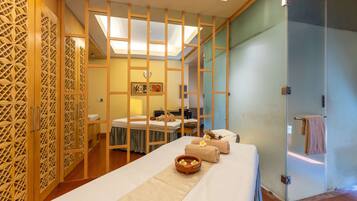 Relax in a stylish space with a large bed, bedside table, and convenient shower access.
