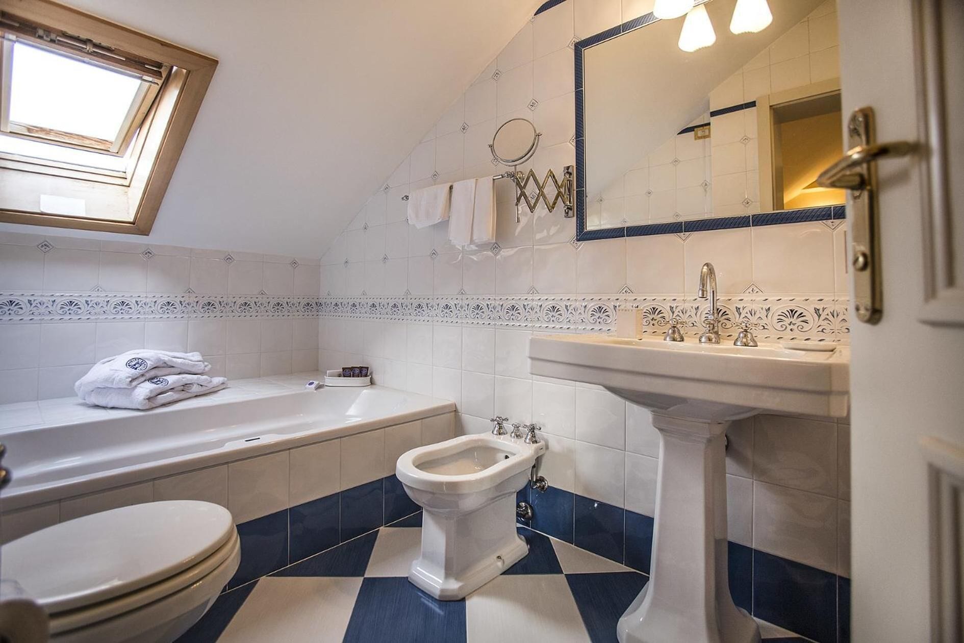 designer toiletries, hair dryer, bathrobes, slippers