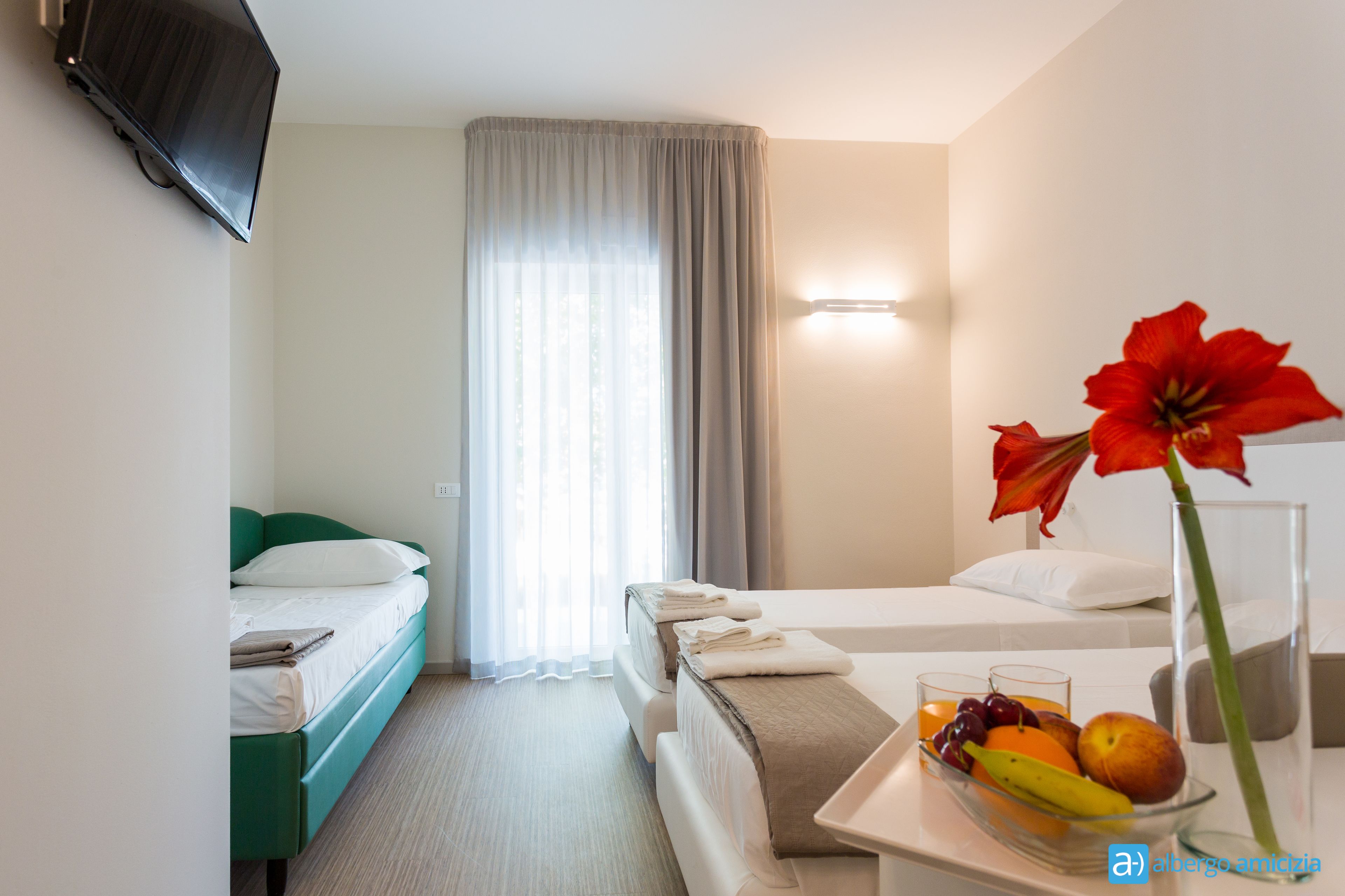 quadruple room | minibar, in-room safe, desk, blackout curtains