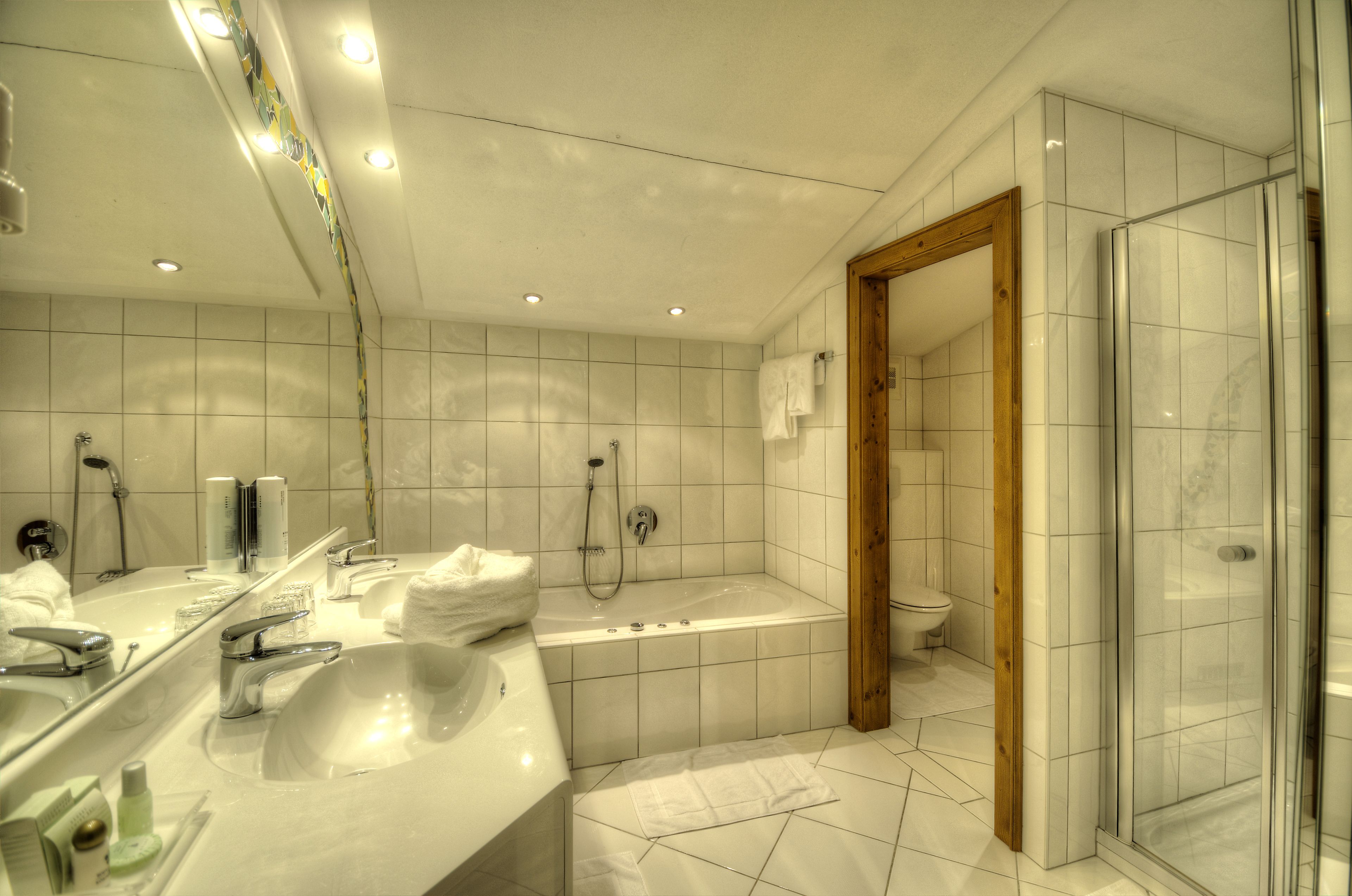 superior double room, balcony, mountain view | bathroom | eco-friendly toiletries, hair dryer, bathrobes, towels