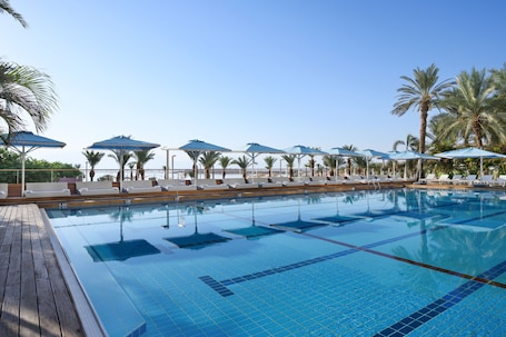 Indoor pool, outdoor pool, pool umbrellas, sun loungers