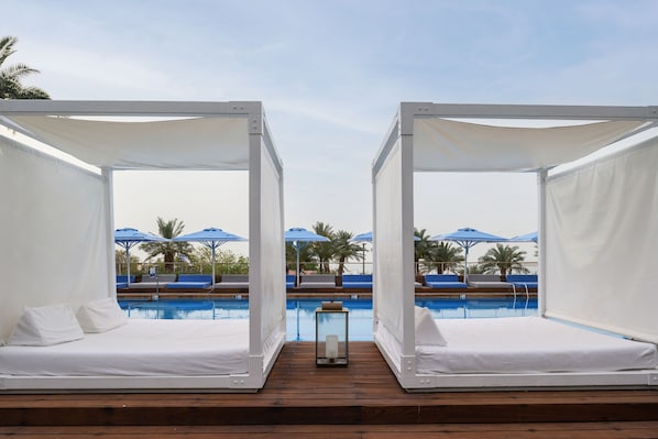 Indoor pool, outdoor pool, pool umbrellas, sun loungers