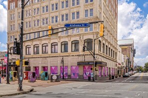 A building with a classic architectural style, featuring a prominent corner entrance and multiple windows.
