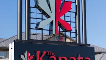 A hotel sign with a maple leaf logo and the name "The Kanata" by BCMinns.