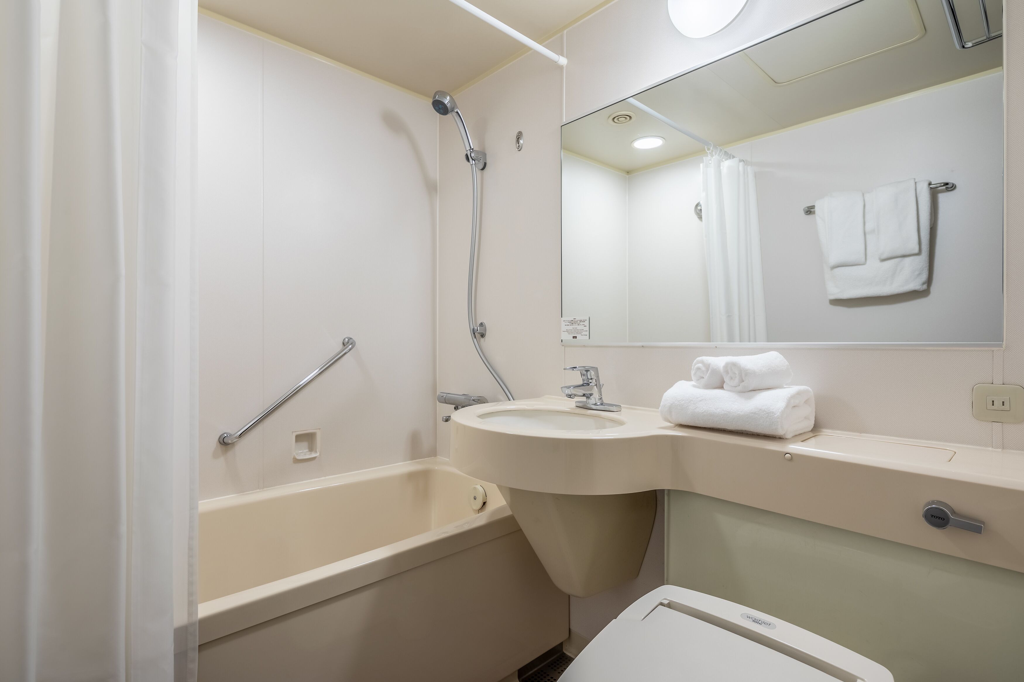 combined shower/bathtub, free toiletries, hair dryer, slippers