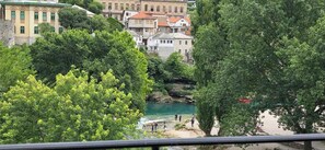 A coastal town with buildings, trees, and a river.
