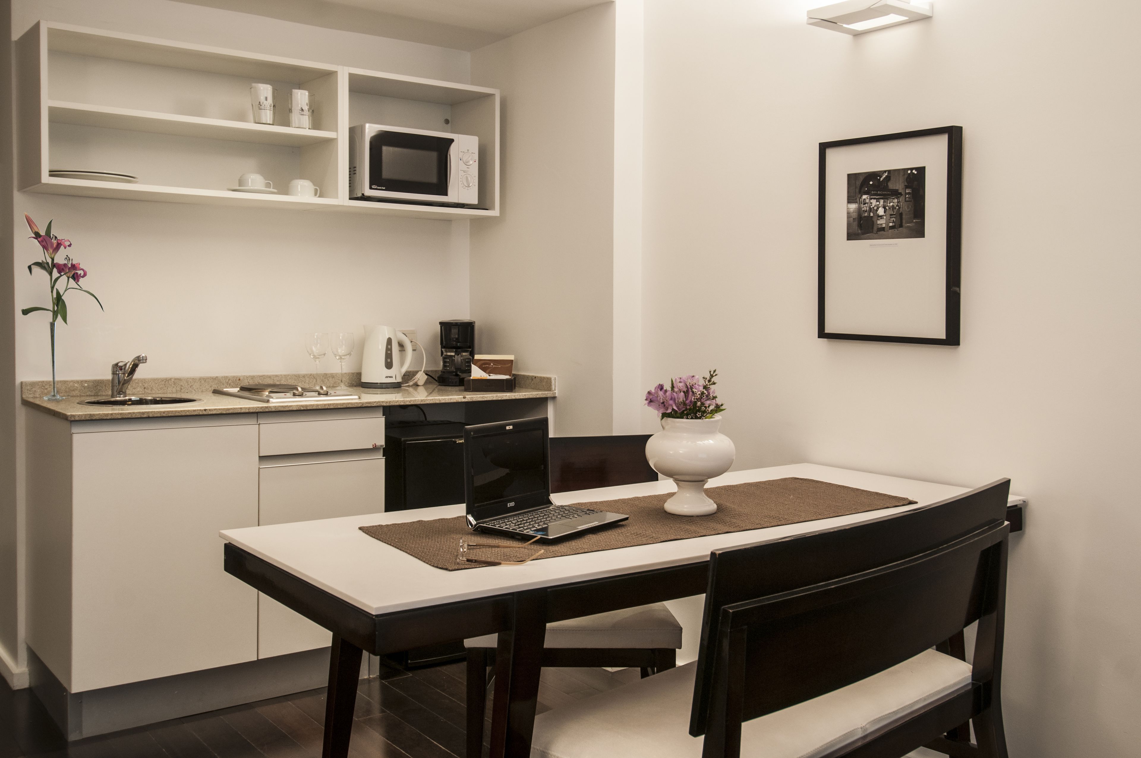 fridge, microwave, coffee/tea maker, cookware/dishes/utensils