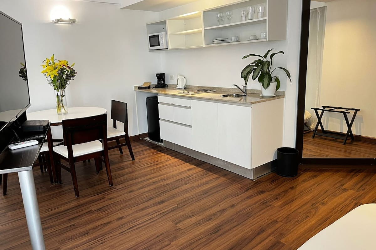 fridge, microwave, coffee/tea maker, cookware/dishes/utensils