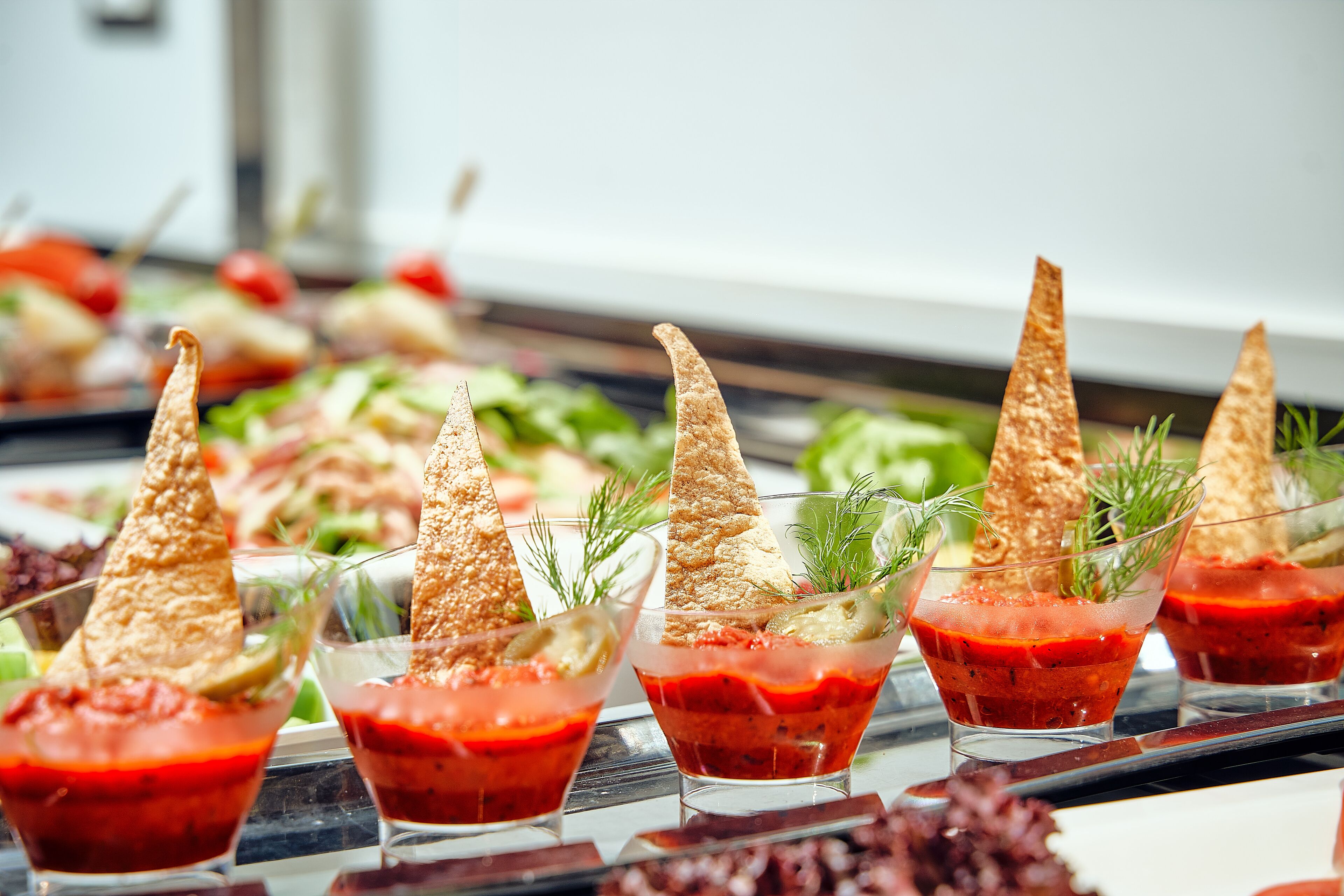 A buffet with various dishes and drinks.