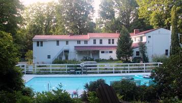 Outdoor pool, a heated pool, sun loungers
