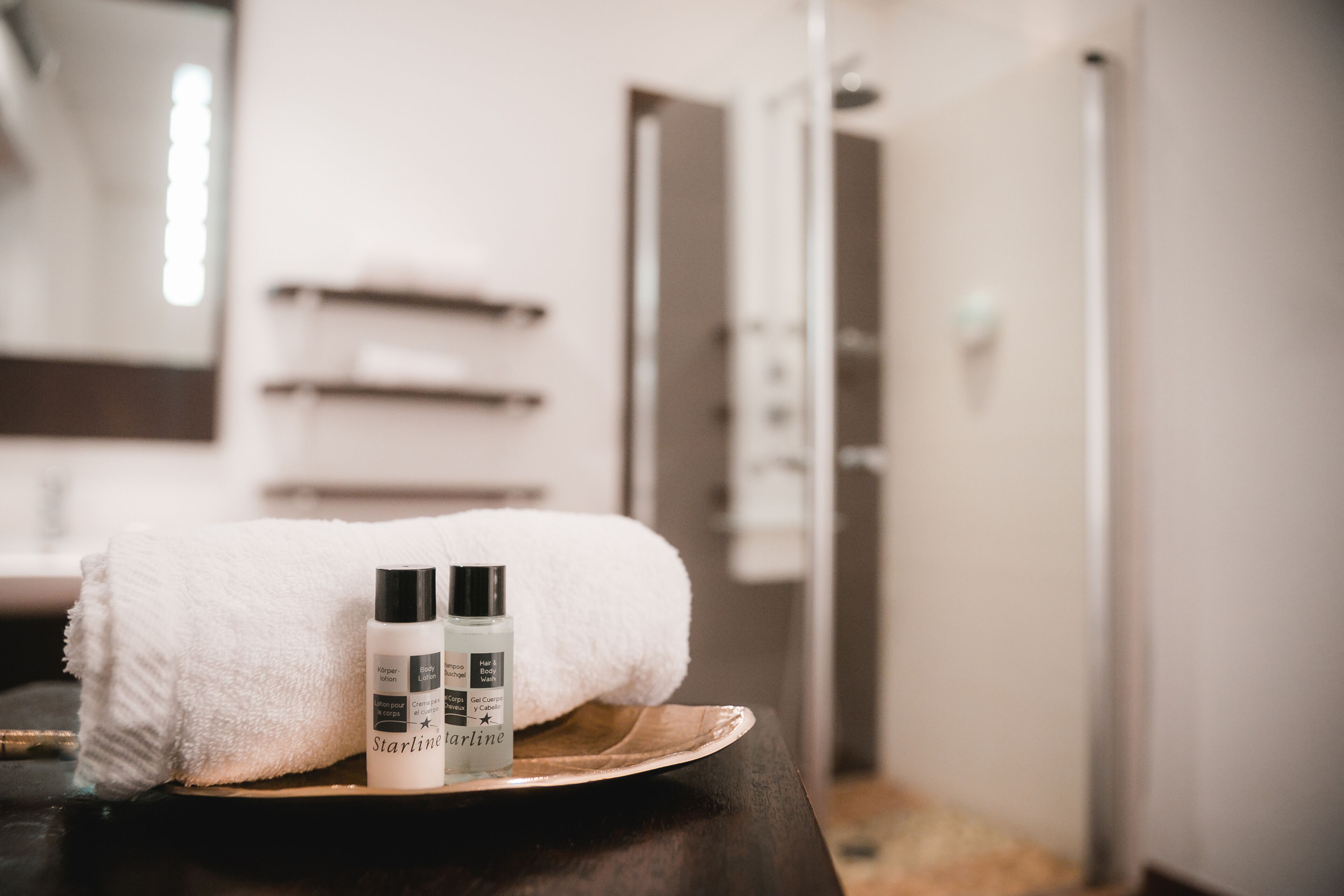 shower, rainfall showerhead, hair dryer, towels