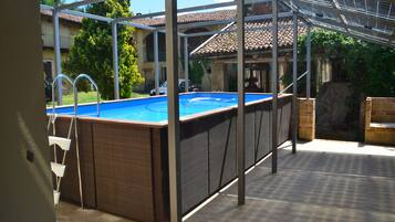 Outdoor pool, pool umbrellas, pool loungers