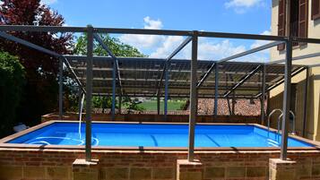 Outdoor pool, pool umbrellas, sun loungers