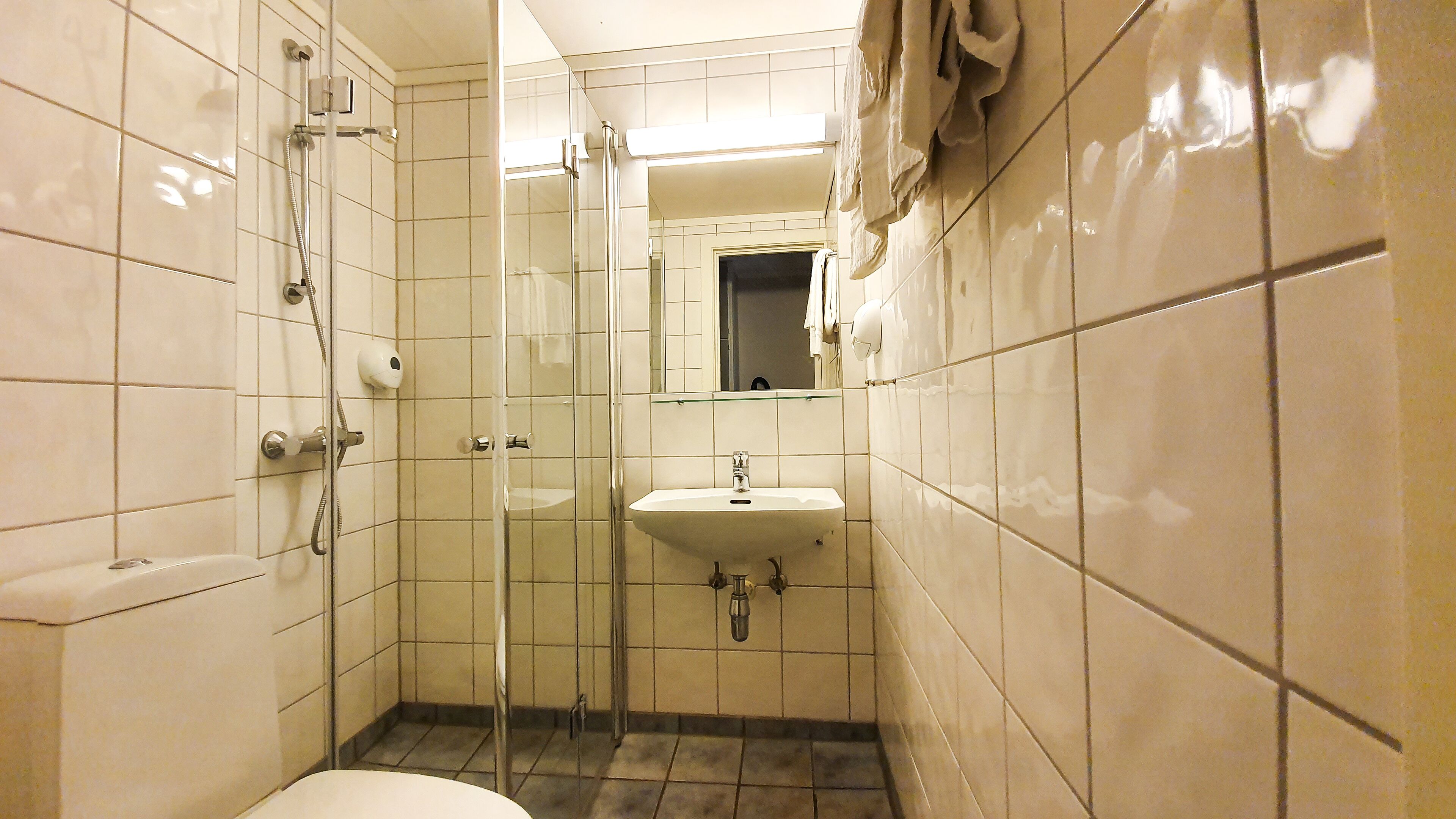economy twin room | bathroom | eco-friendly toiletries, hair dryer, heated floors, towels
