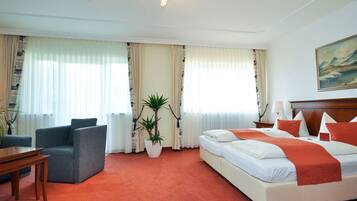 Deluxe Double Room | Minibar, in-room safe, individually furnished, desk