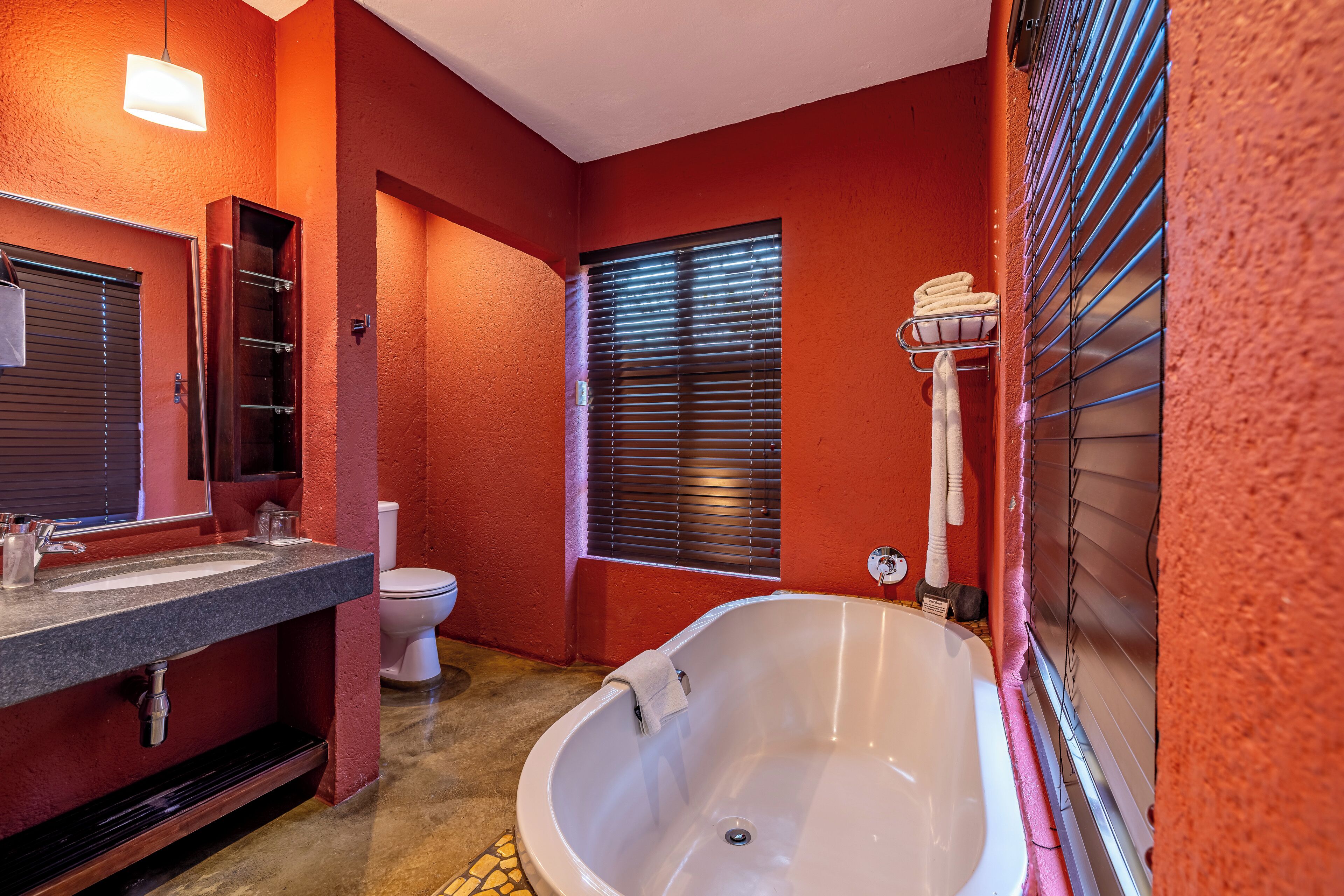 A bathroom with a bathtub, a sink, and a toilet.